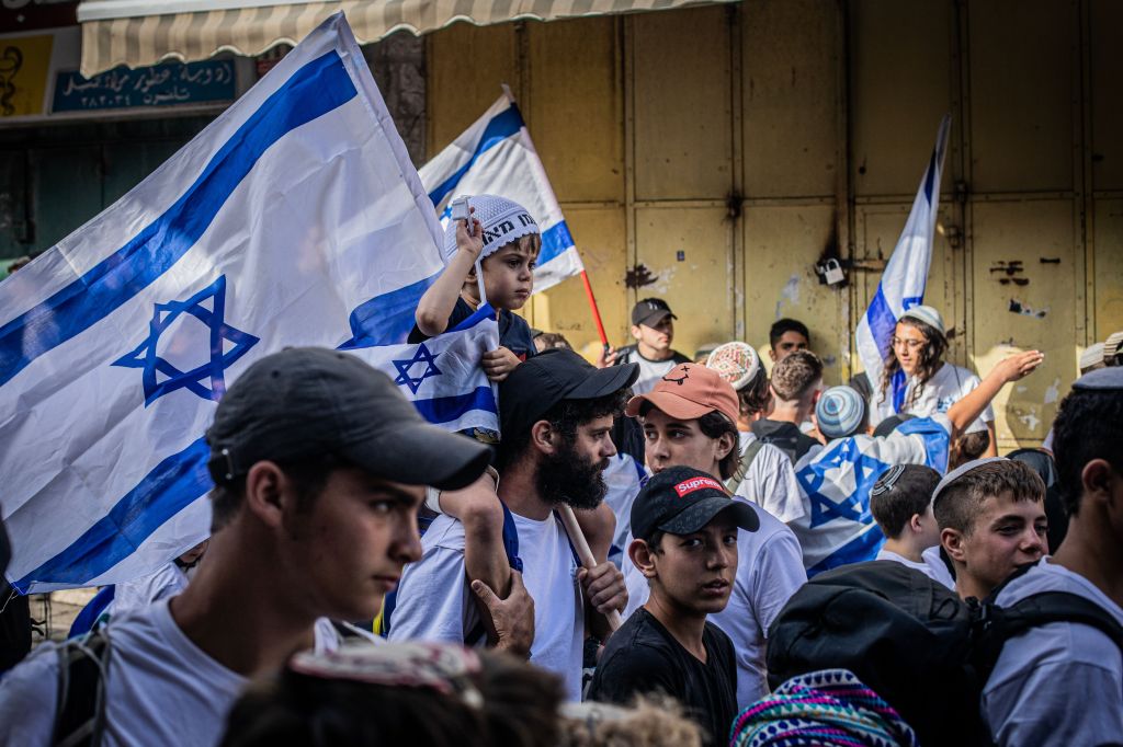 People holding Israeli flag