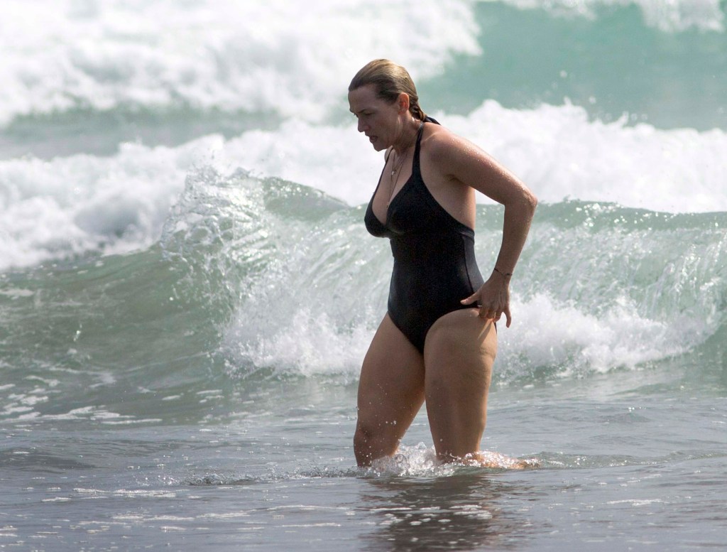 Winslet shows off her beach body in a swimsuit on holiday at Piha Beach near Auckland, New Zealand with her family on Dec. 29.
