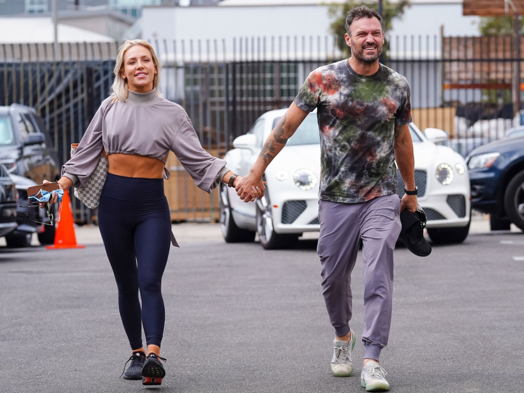 Sharna Burgess holding hands with Brian Austin Green. 