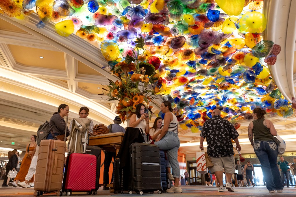 The cyberattack has disrupted operations at MGM Resorts properties such as the Bellagio (above), where long lines formed near the check-in counter.