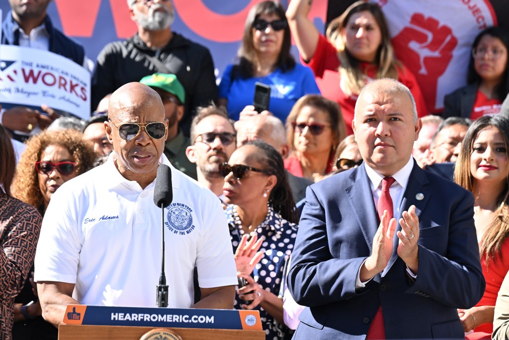 NYC Mayor Eric Adams as NYC Commissioner Mayor's Office of Immigrant Affairs Manuel Castro at a Pro-Migrants Manhattan rally on Aug. 31, 2023.