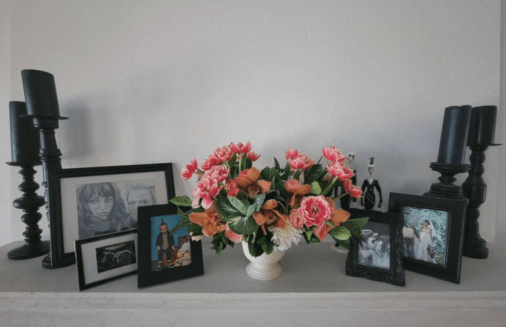 The post featured a bouquet of flowers on a shelf alongside photos of the couple and their children.