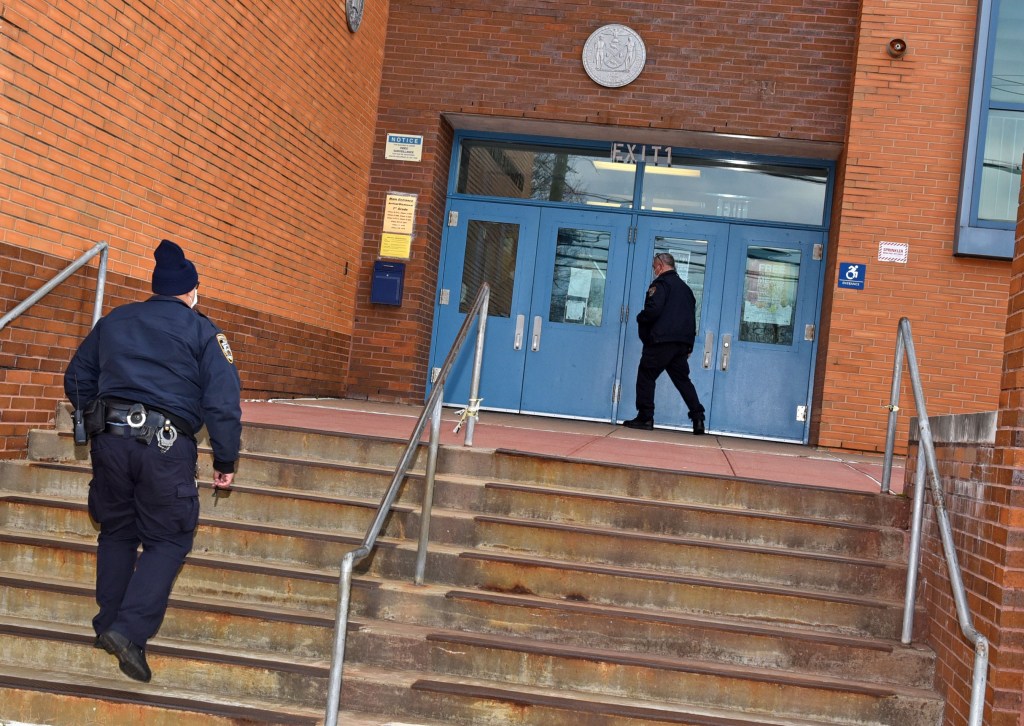 12/7/20  Public schools located in orange zones are not open today because they have not met the coronavirus testing criteria set by the state.  Here, you can see two NYPD school safety officers at the entrance to an empty PS #6, located in Tottenville. (pictured) The officers came by to see if the school was open or closed.  555 Page Avenue, Staten Island, NY.  