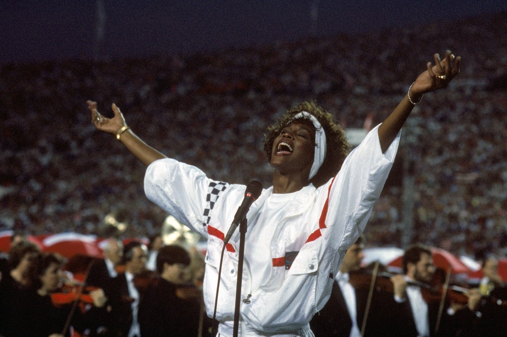 Whitney Houston sings the National Anthem before a game with the New York Giants taking on the Buffalo Bills prior to Super Bowl XXV at Tampa Stadium on January 27, 1991 in Tampa, Florida.