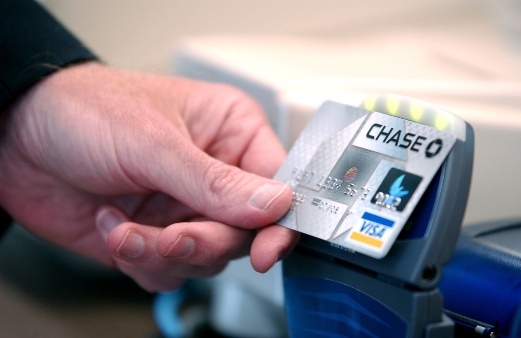 A hand displaying the new Chase Bank credit card with 'blink' technology during a press conference at an Arby's restaurant in Denver, Colorado on June 8, 2005